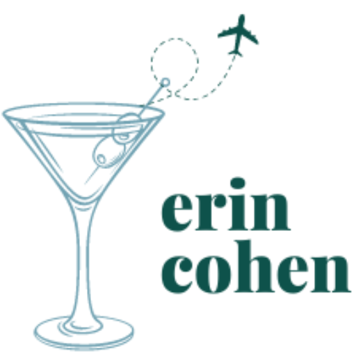 Martini glass with airplane flyting out of the top and text says Erin Cohen.