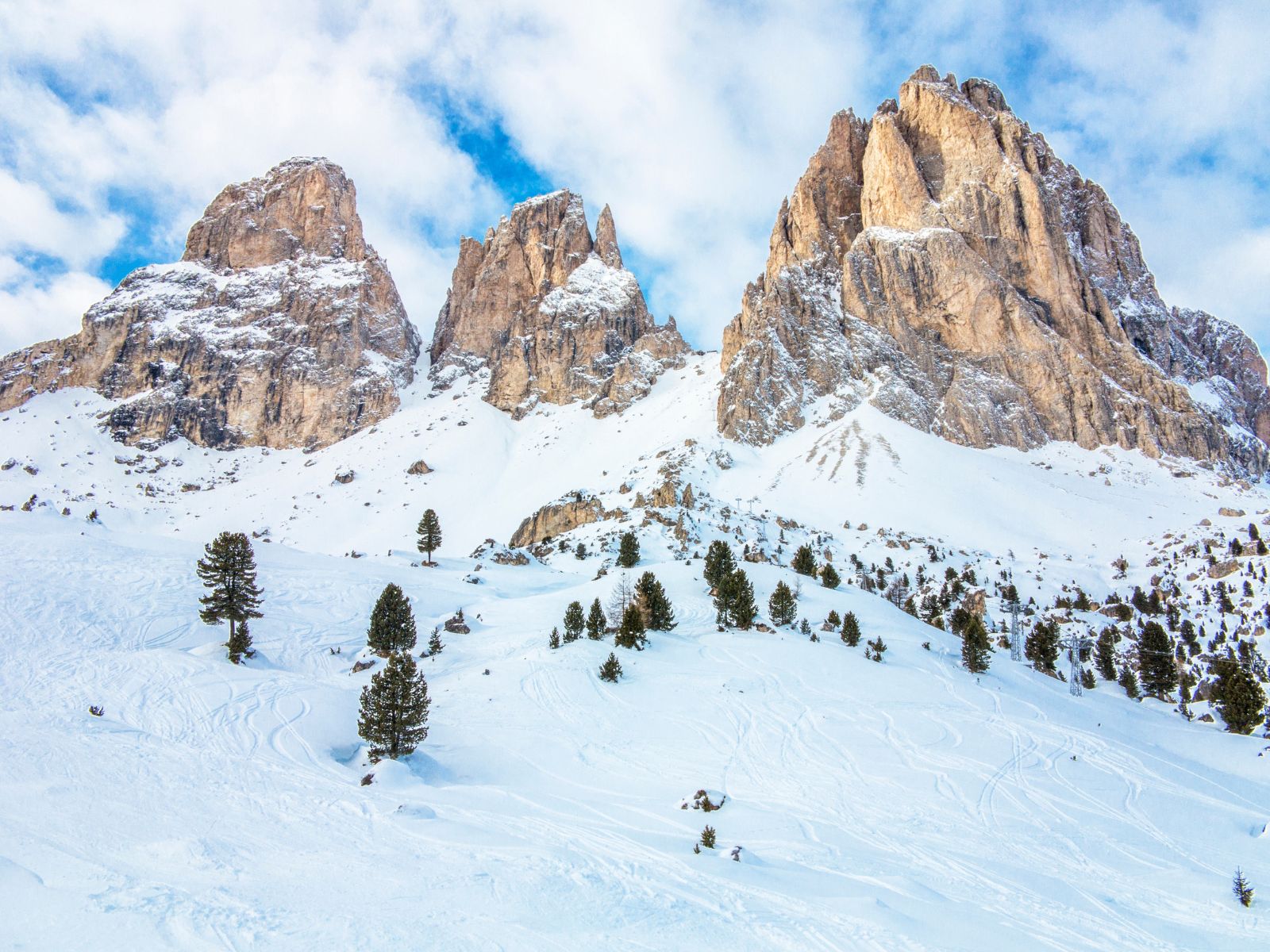 Dolomites Places To Stay photo of the snowy mountains in the Dolomites.