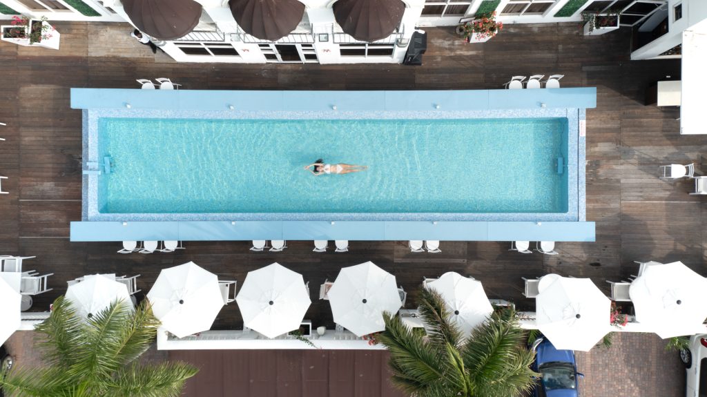 At one of the best babymoon destinations in the Caribbean. Aerial footage of me swimming in the hotel pool in Jamaica. 