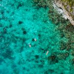 Aerial view of a beach in the Caribbean for one of the best Babymoon Destinations in the Caribbean.