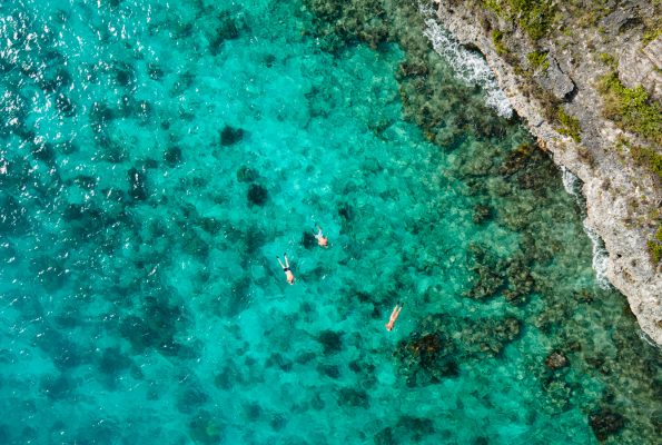 Aerial view of a beach in the Caribbean for one of the best Babymoon Destinations in the Caribbean.