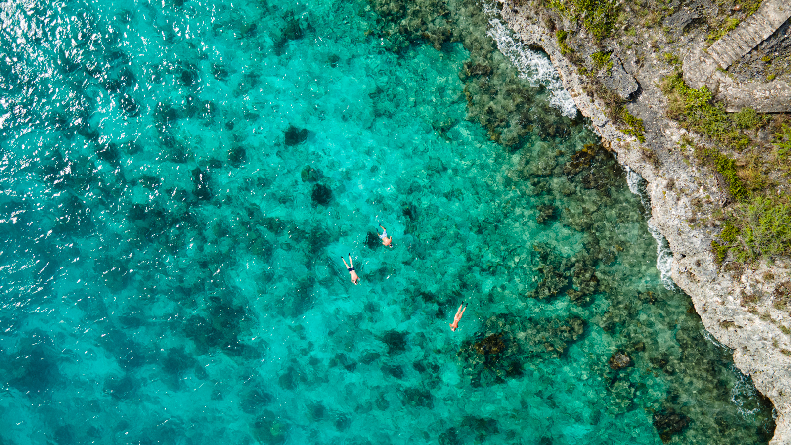 Aerial view of a beach in the Caribbean for one of the best Babymoon Destinations in the Caribbean.