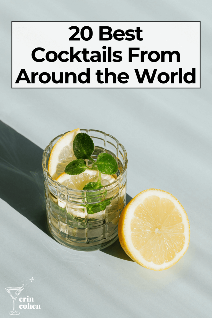 Graphic with the text “20 Best Cocktails From Around the World” above a short glass cocktail garnished with lemon and mint, with a sliced lemon beside the glass